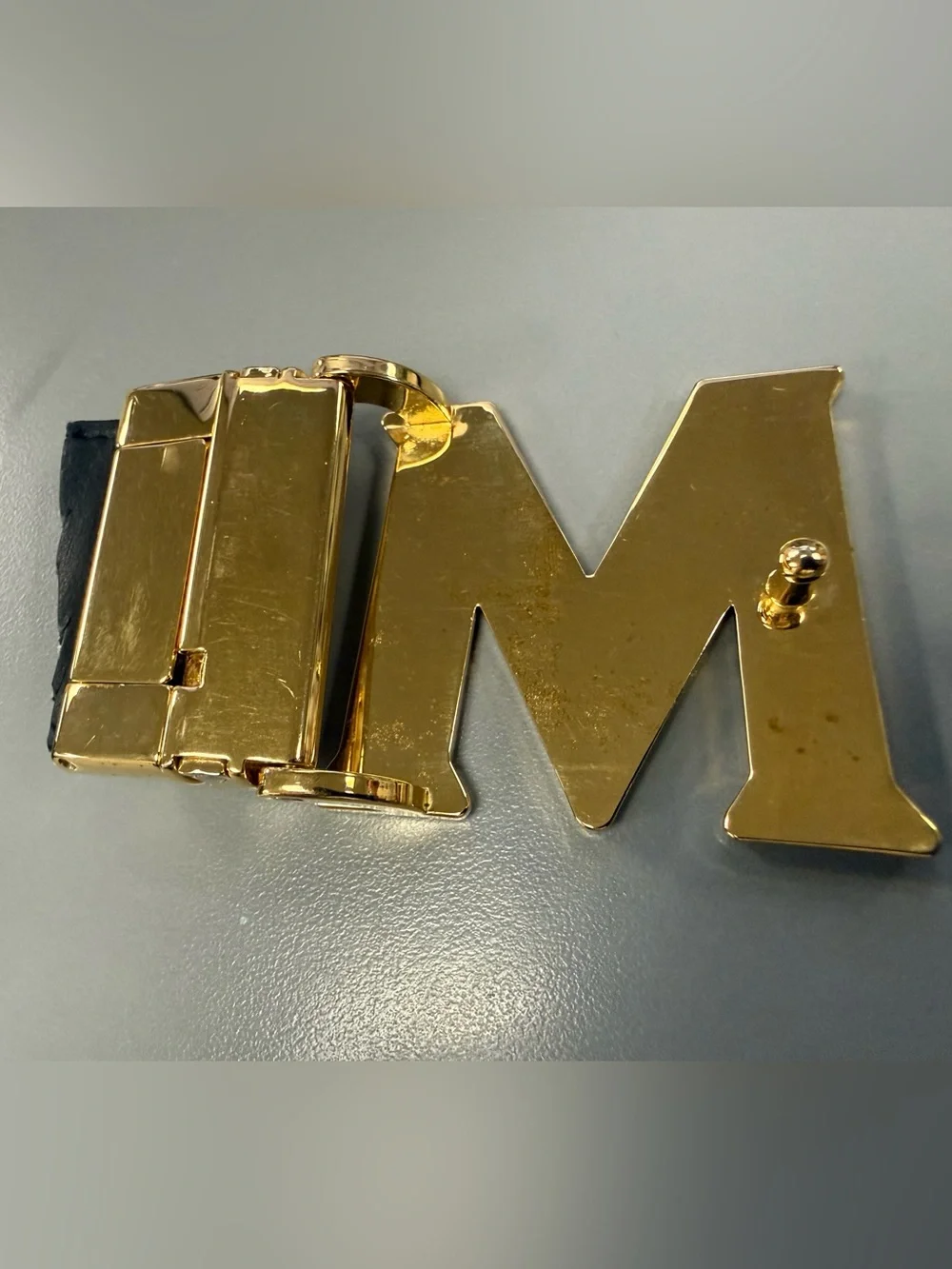 MCM Gold Tone Initial “M” Automatic Ratchet Belt Buckle Designer Logo